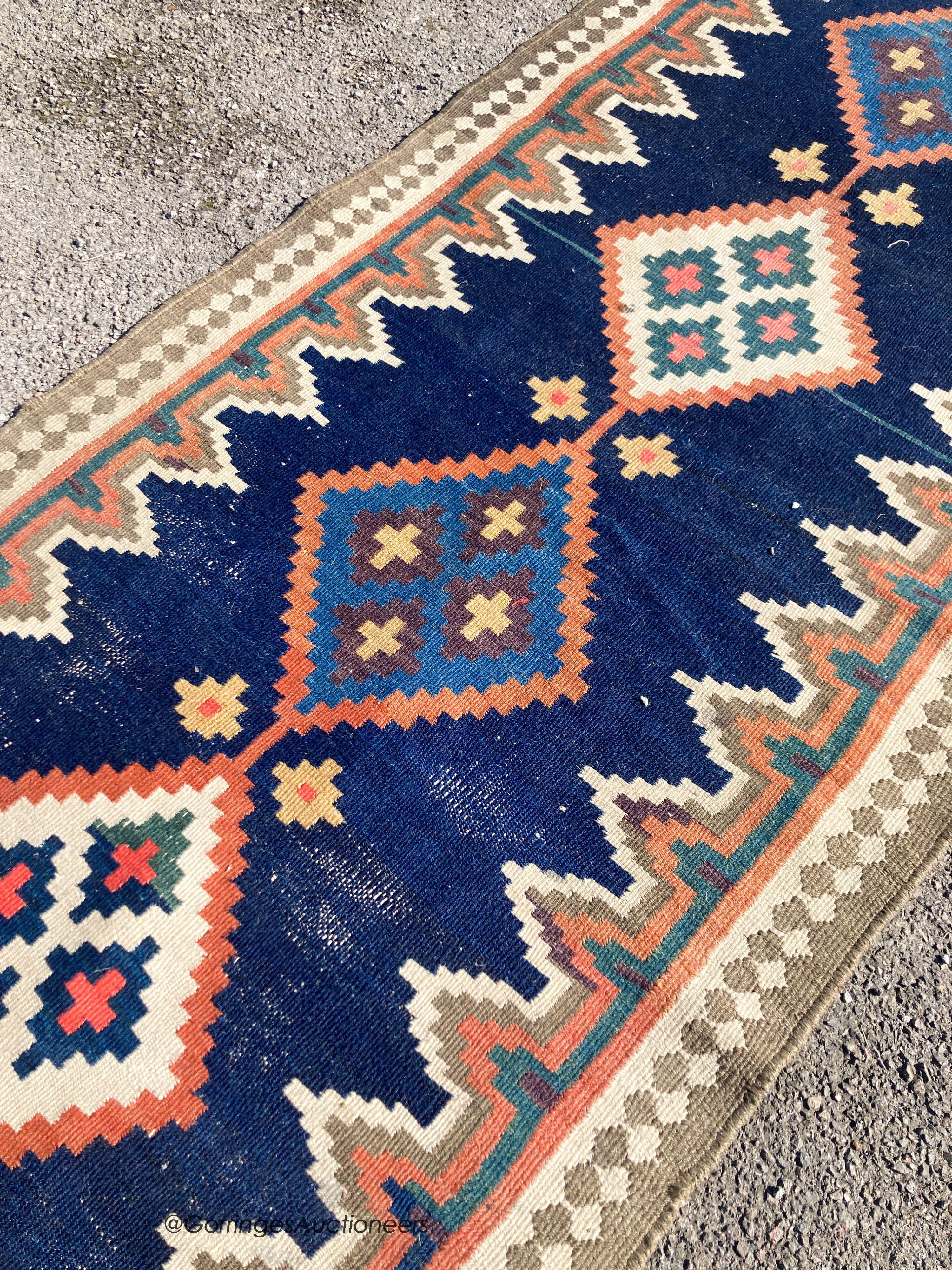 A long Eastern flatweave Kelim runner, 540 x 108cm